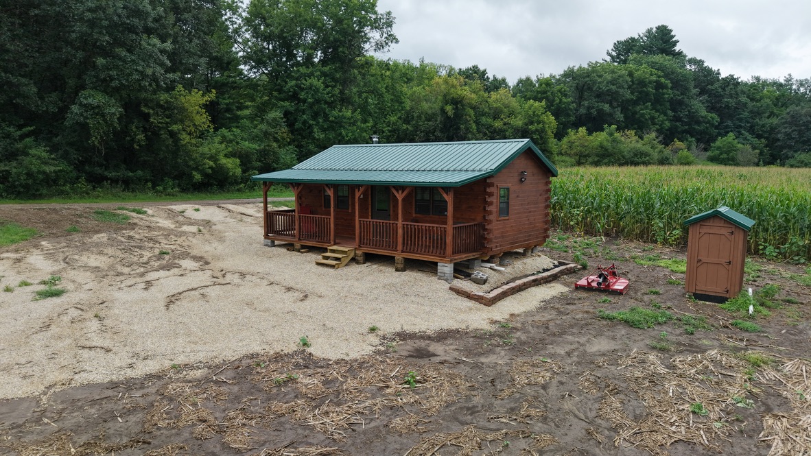 Big River Cabins finished log cabin with covered porch